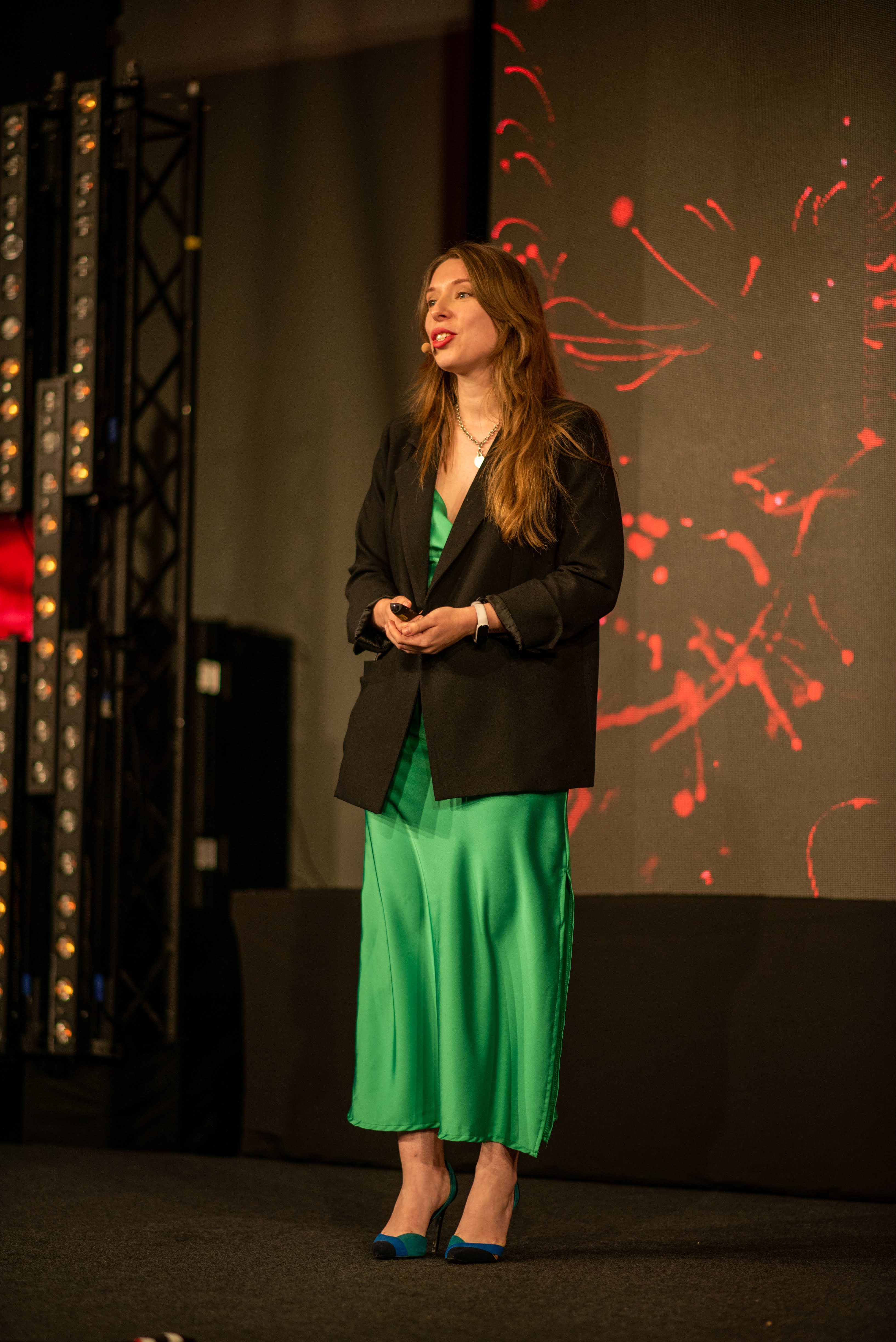 Anna Borbotko speaking on stage